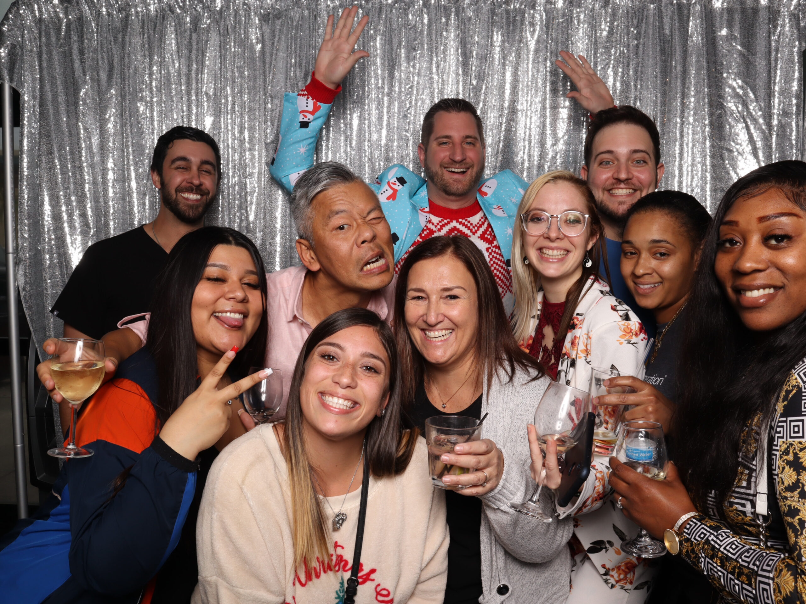 Party Photo Booth Rental - Guests laughing in front of the photo booth at an Orlando party with instant photo prints