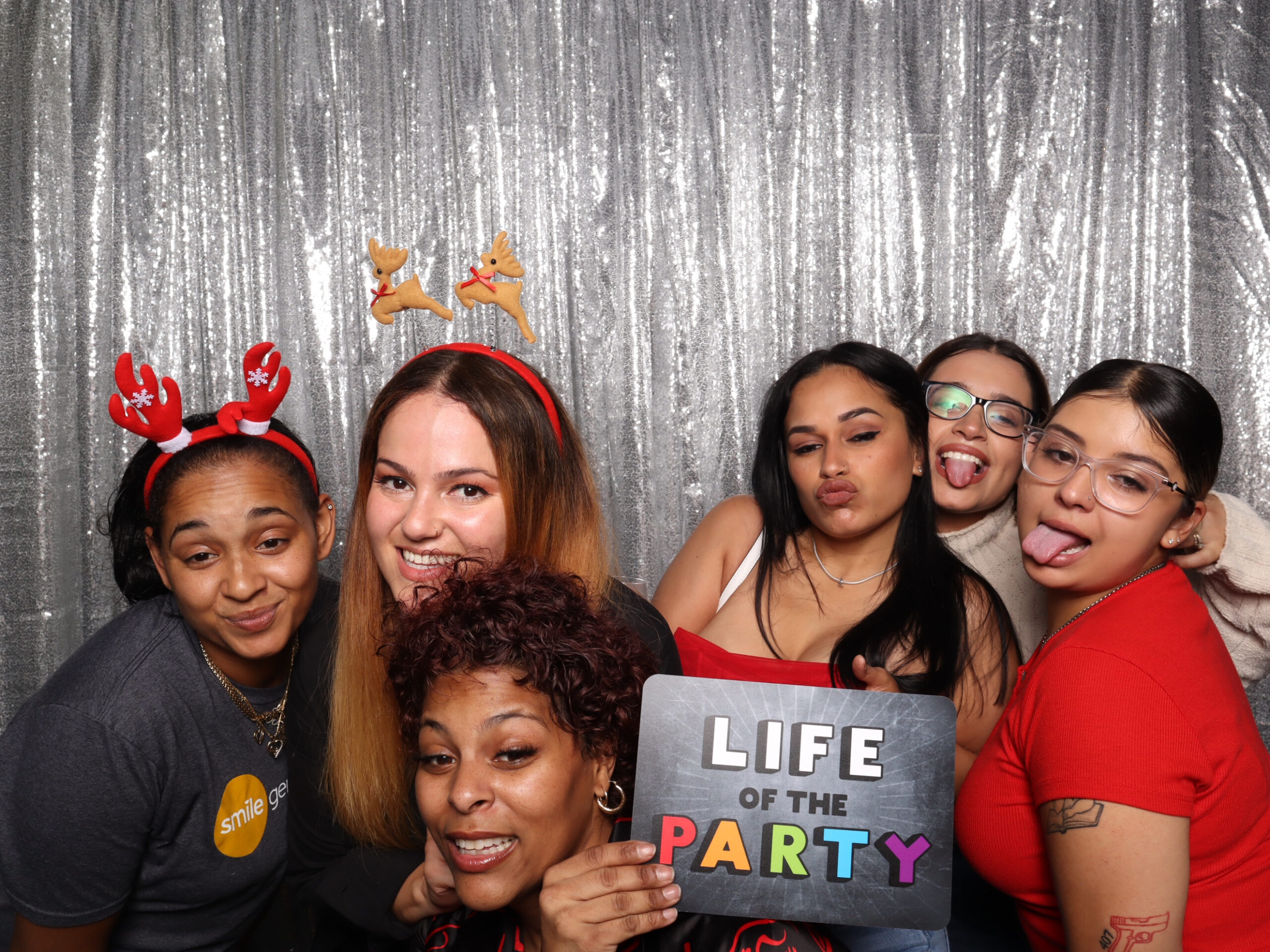 Guests laughing in front of a digital photo booths at a corporate event in Orlando