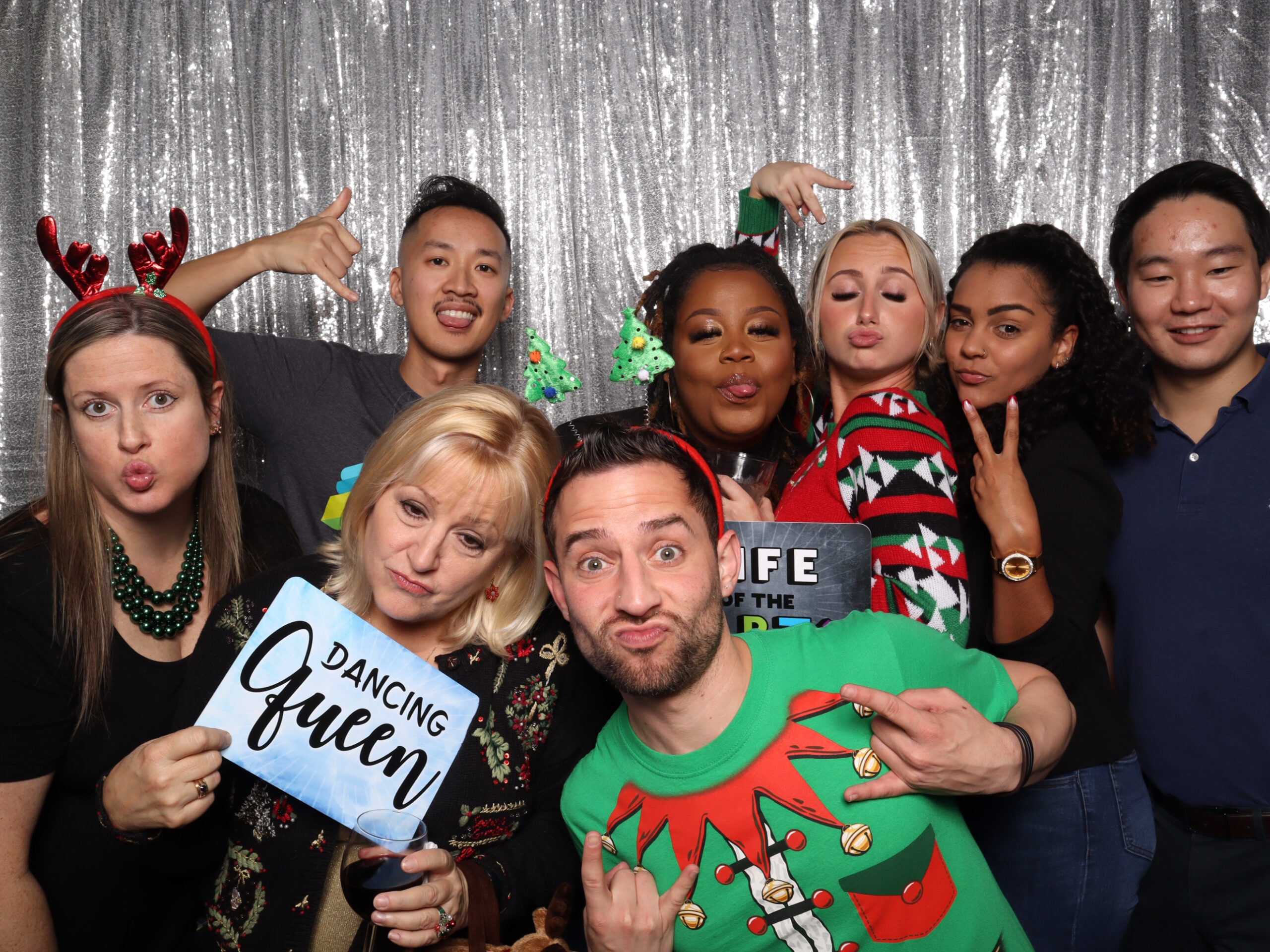 Rent a Selfie Station:Guests posing with digital props at a Strata Booth selfie station in Orlando