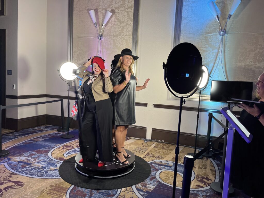 Guests using a 360 booth at conference in downtown Orlando event during gala