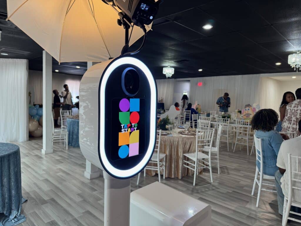 Photo booth rental setup at modern Orlando event with branded overlay and live-sharing screen