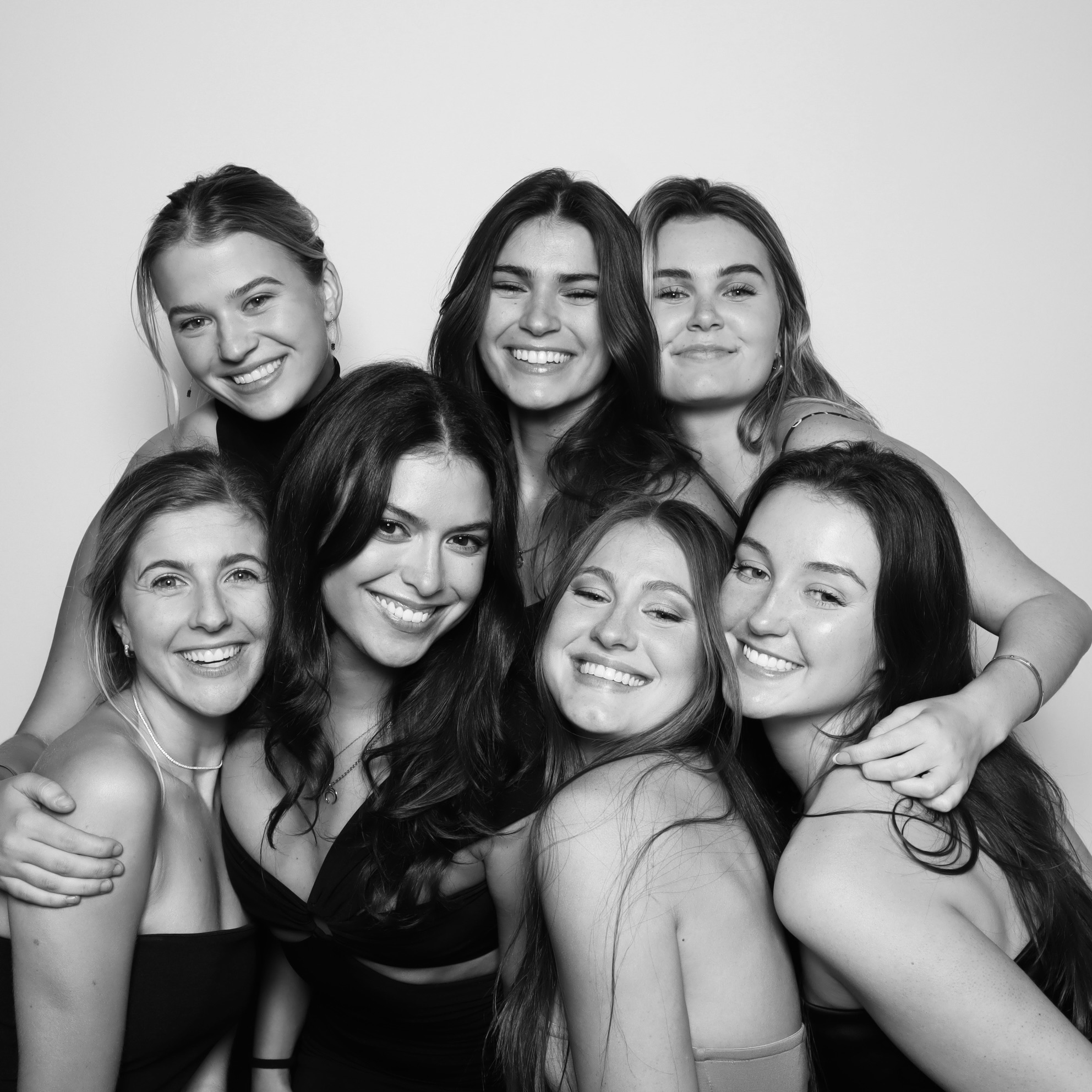 Quinceanera Photo Booth Rental: Teen girl celebrating her quinceañera in a photo booth with custom backdrop