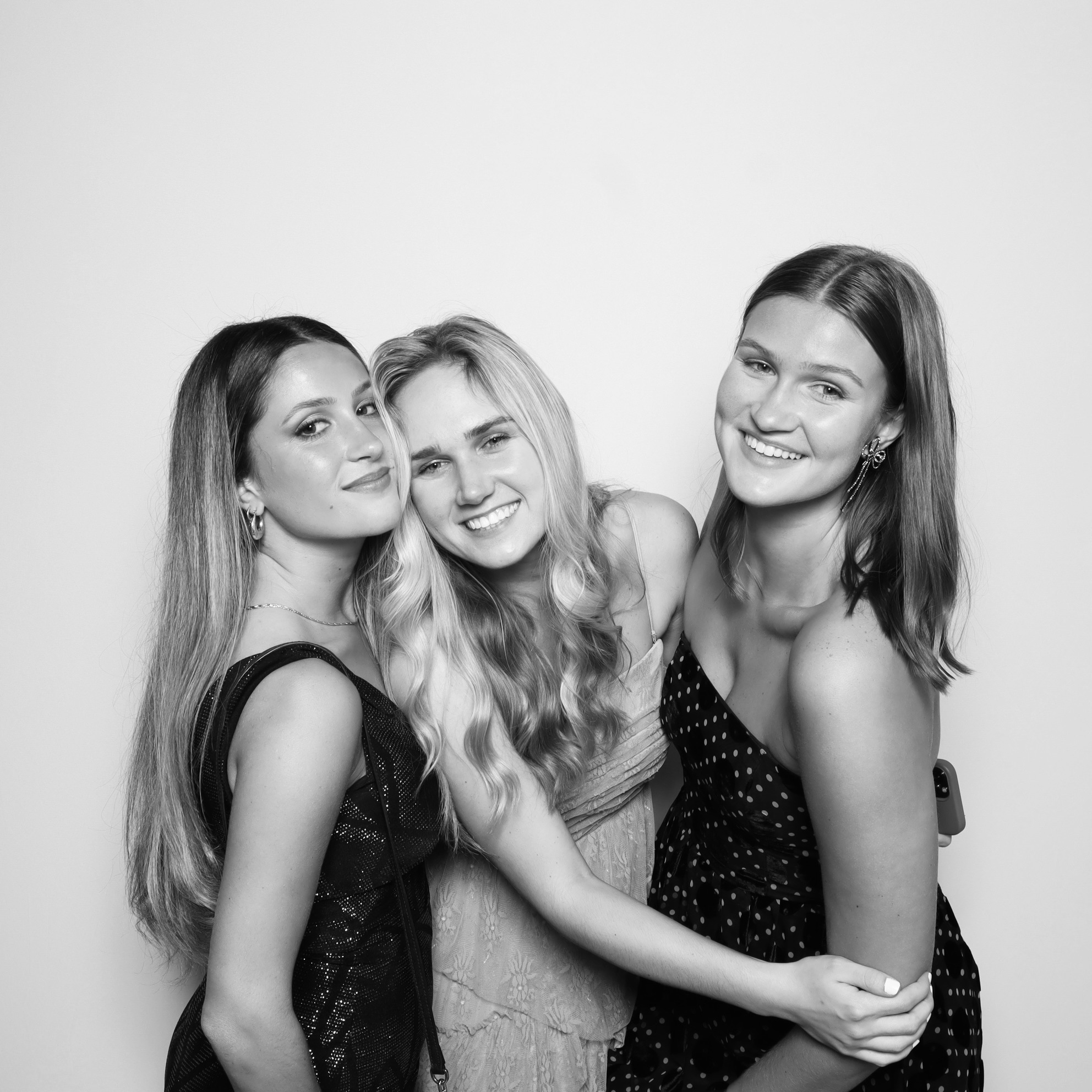 Rent a Photobooth:Modern photo booth setup with floral backdrop at an outdoor Orlando wedding