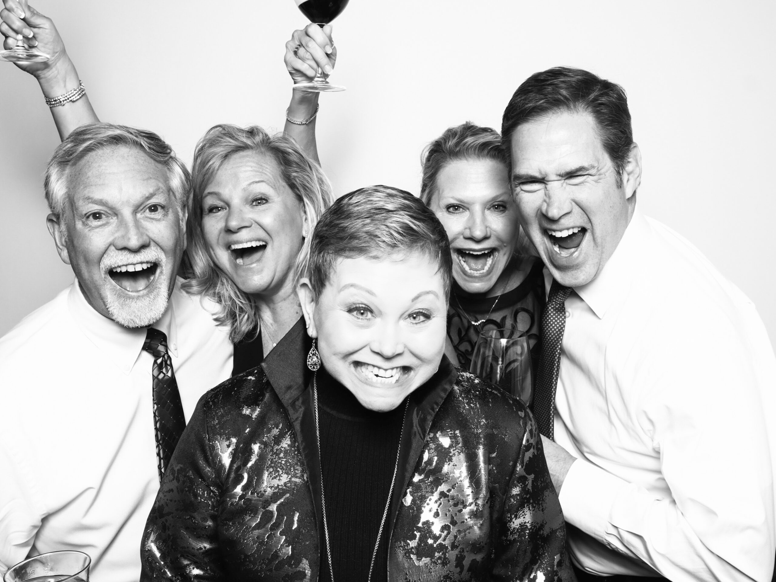360 Photo Booth Rental Price:Guests smiling on a 360 photo booth platform at an Orlando bar event