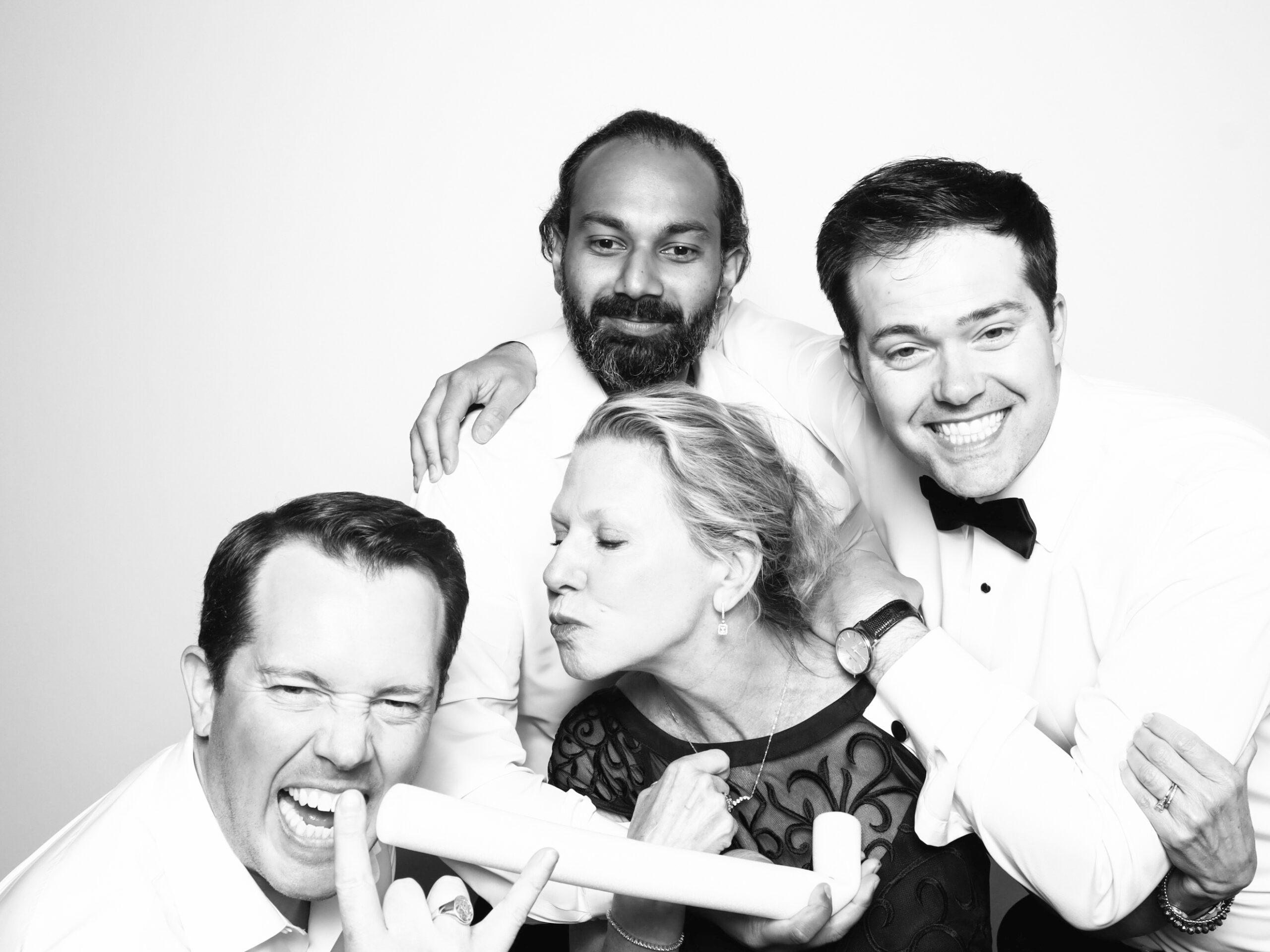Photo Booth Rental Florida:Guests posing in a modern photo booth rental in Florida with tropical décor