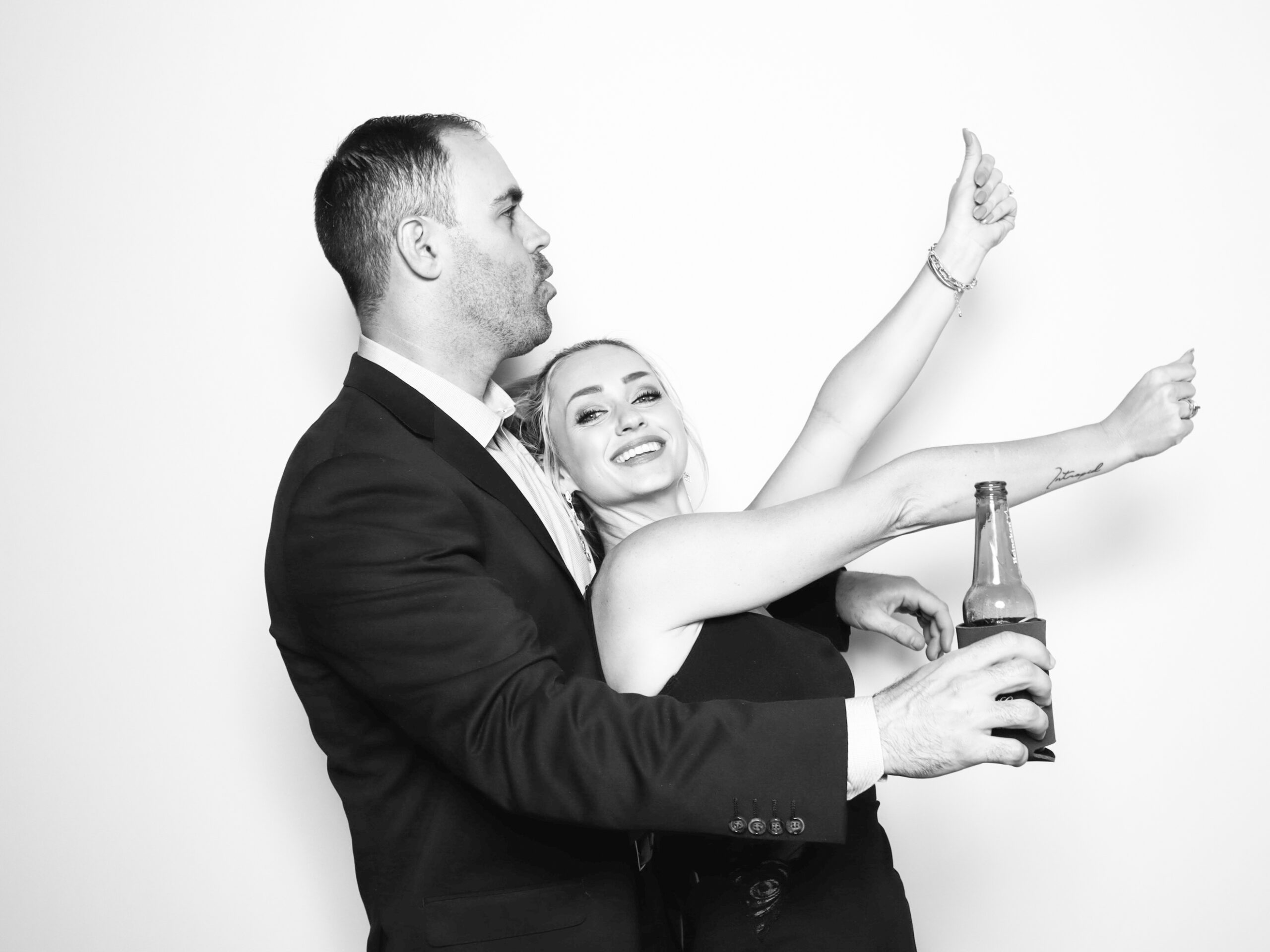 The Booth Photo Booth Company:Elegant guests using a modern open-air photo booth at a luxury Orlando event