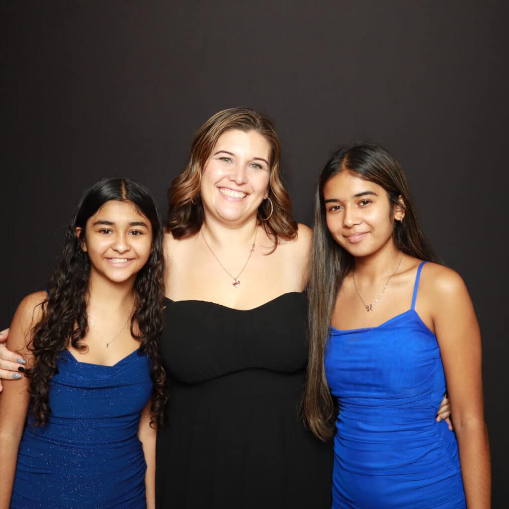 Elegant photo booth with floral backdrop and branded printouts for a Florida quinceañera