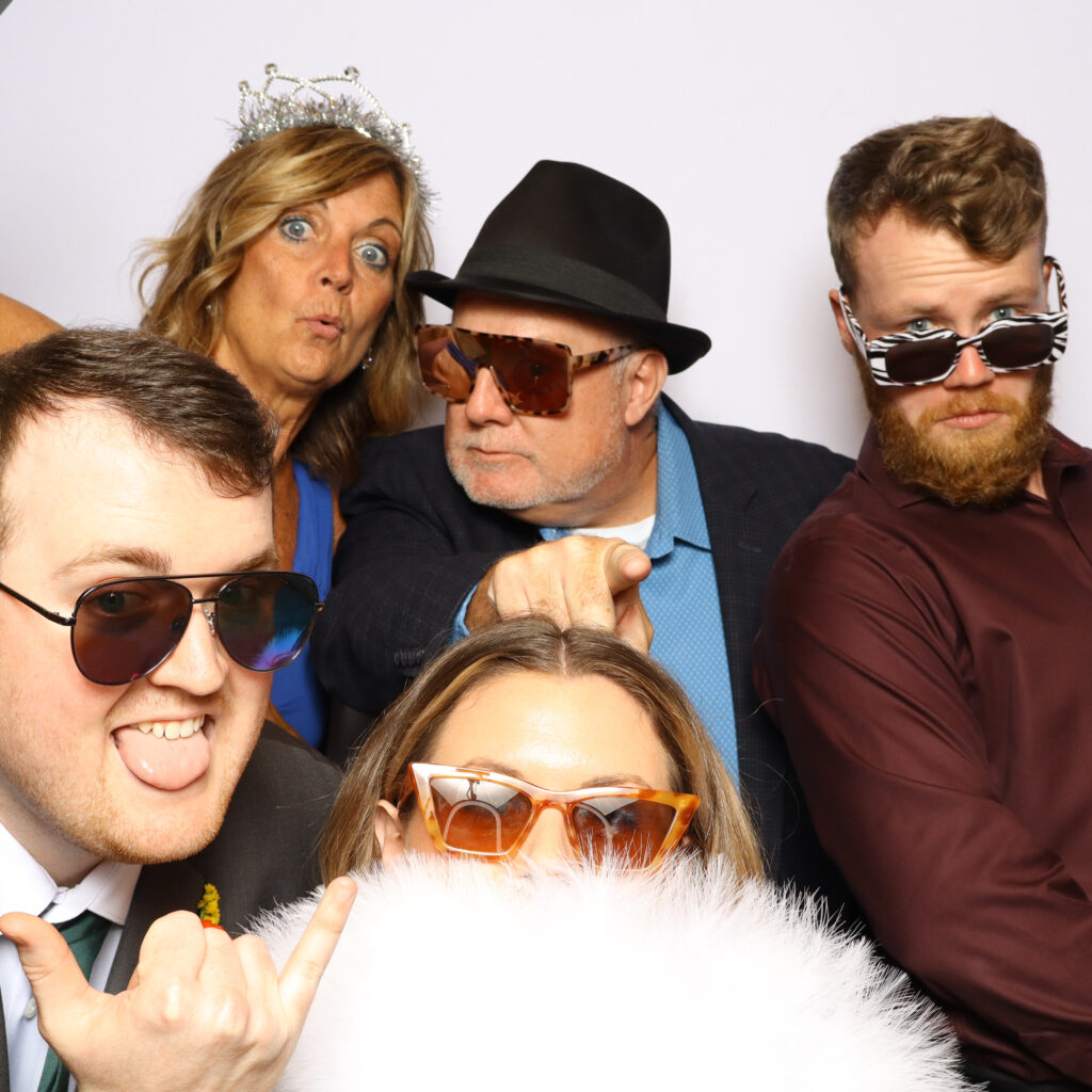 Printed photo strips from a rental booth at a corporate party