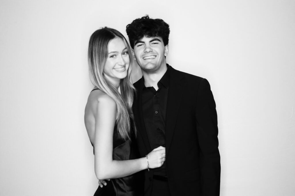 Elegant wedding guests taking boomerang videos with a digital photo booth