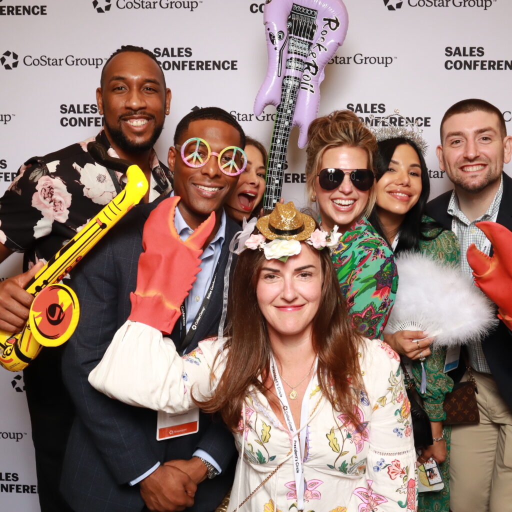 Stylish couple using a photo booth at an Orlando celebration