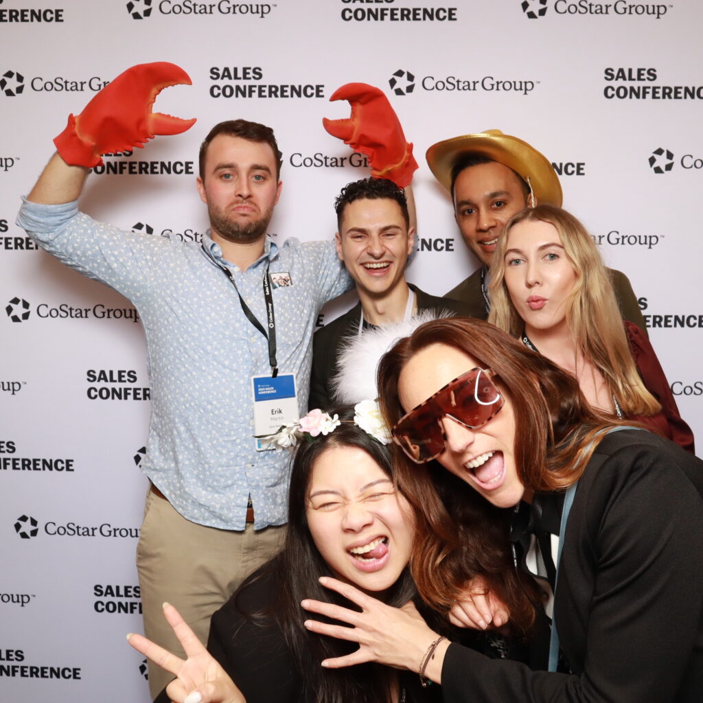 Guests engaging with a photo booth corporate experience