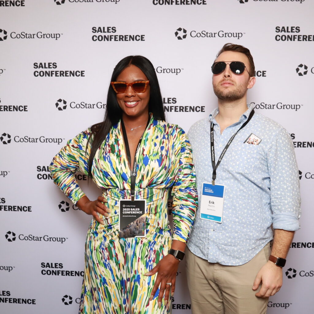 Corporate event guests using a branded touchscreen photo booth
