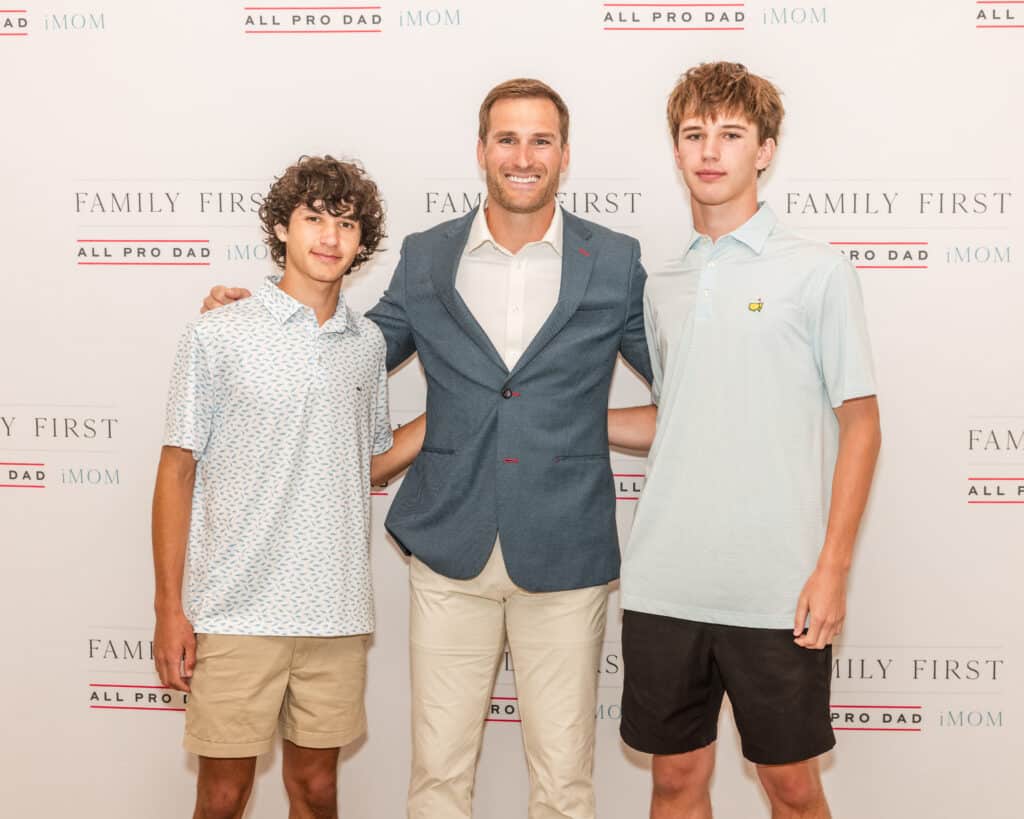 NFL quarterback Kirk Cousins meets a guest at the All Pro Dad event in Orlando