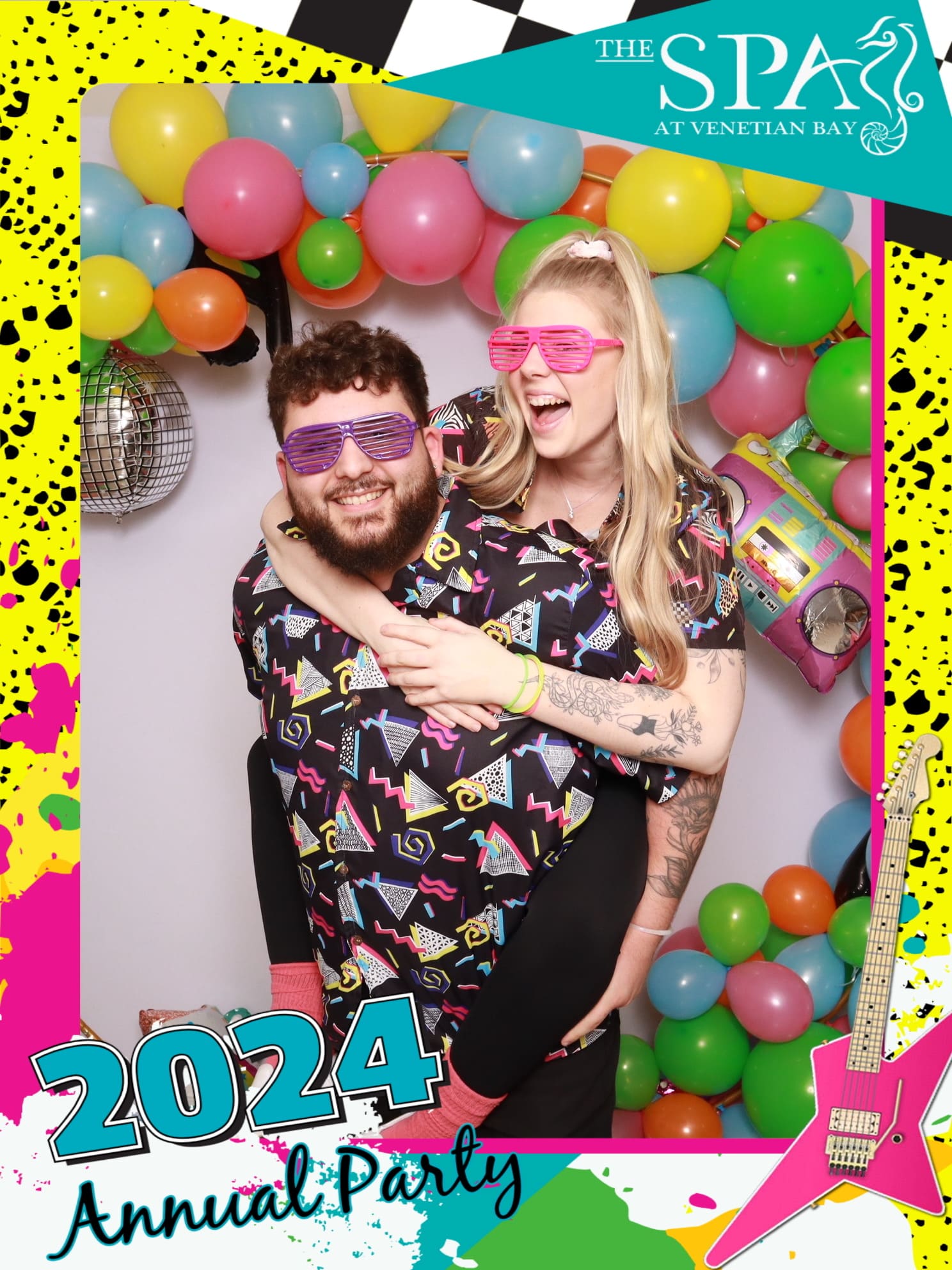 Guests posing with fun 80’s props at The Spa Venetian Bay Annual Party 2024 using the Pro DSLR Photo Booth.