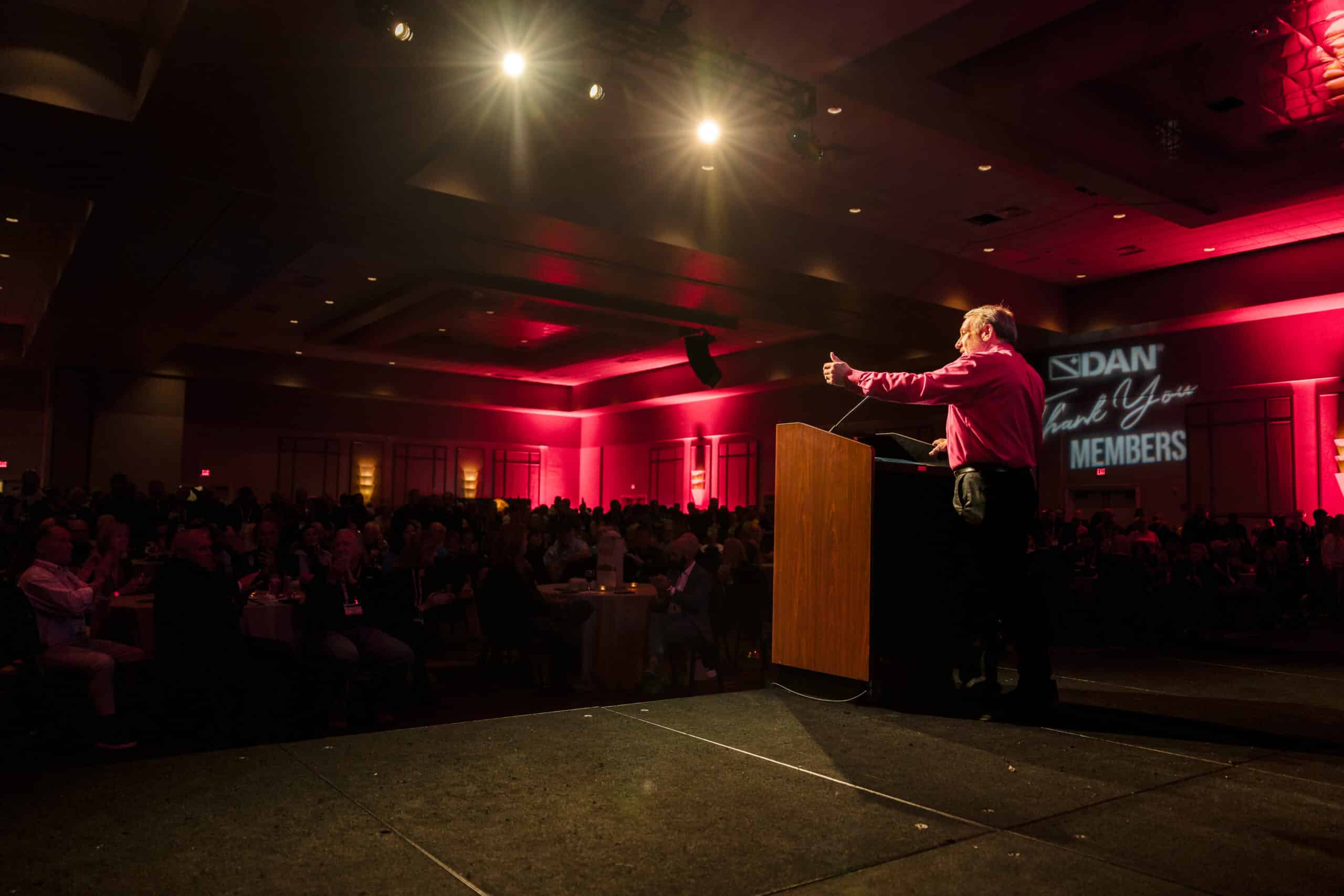 Orlando event photographer capturing a corporate conference with speakers, guests, and branded event details